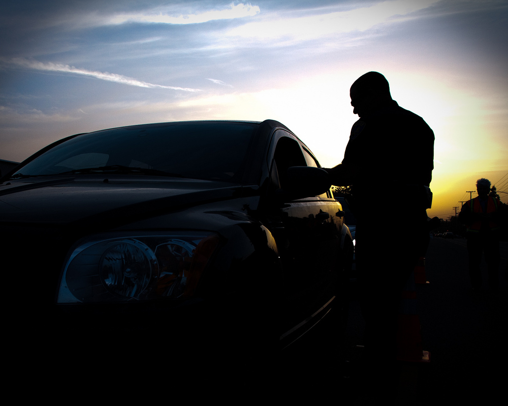 extreme DUI in Phoenix - silhouette of a man beside a car