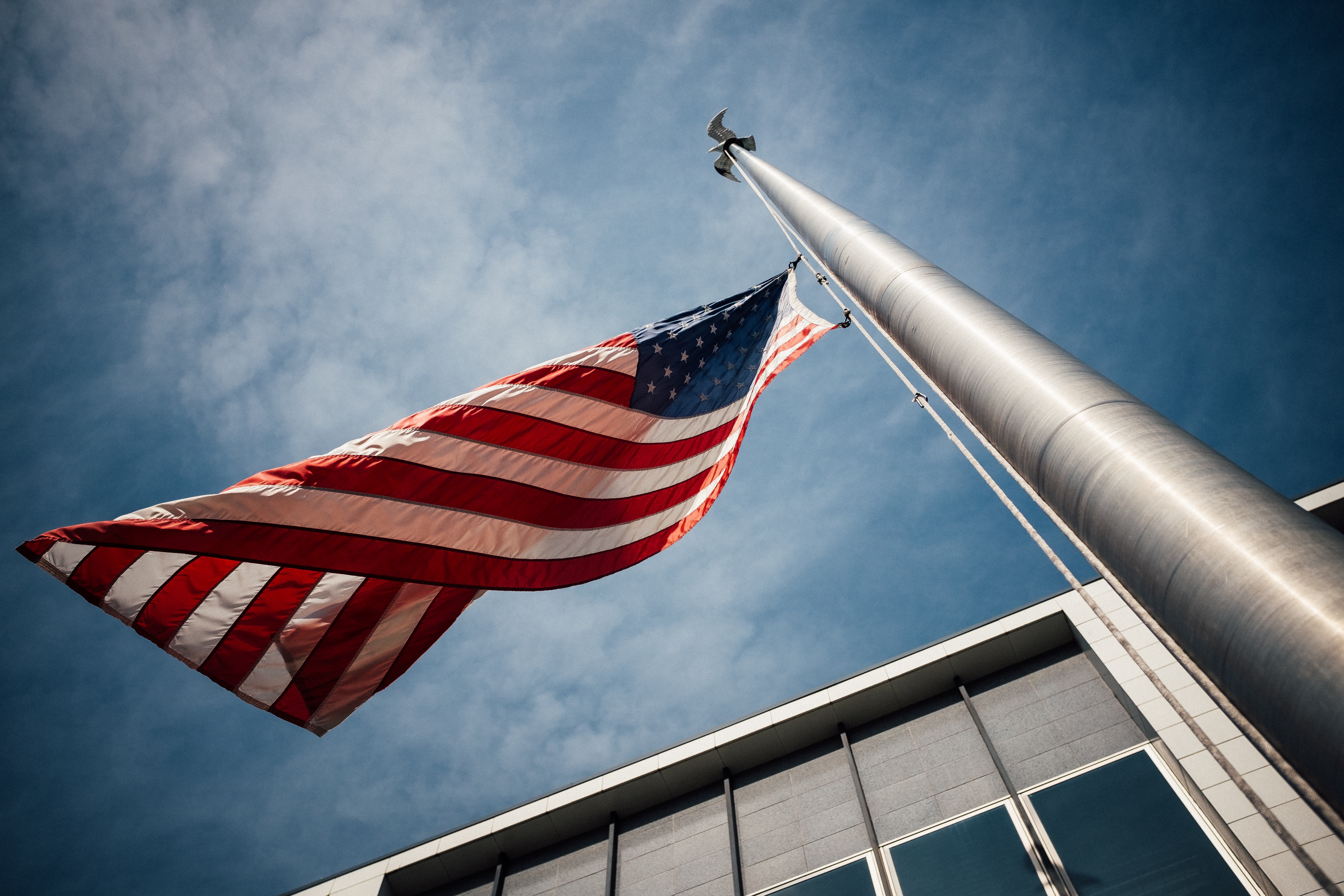 felony in Phoenix - US flag being raised up a flagpole