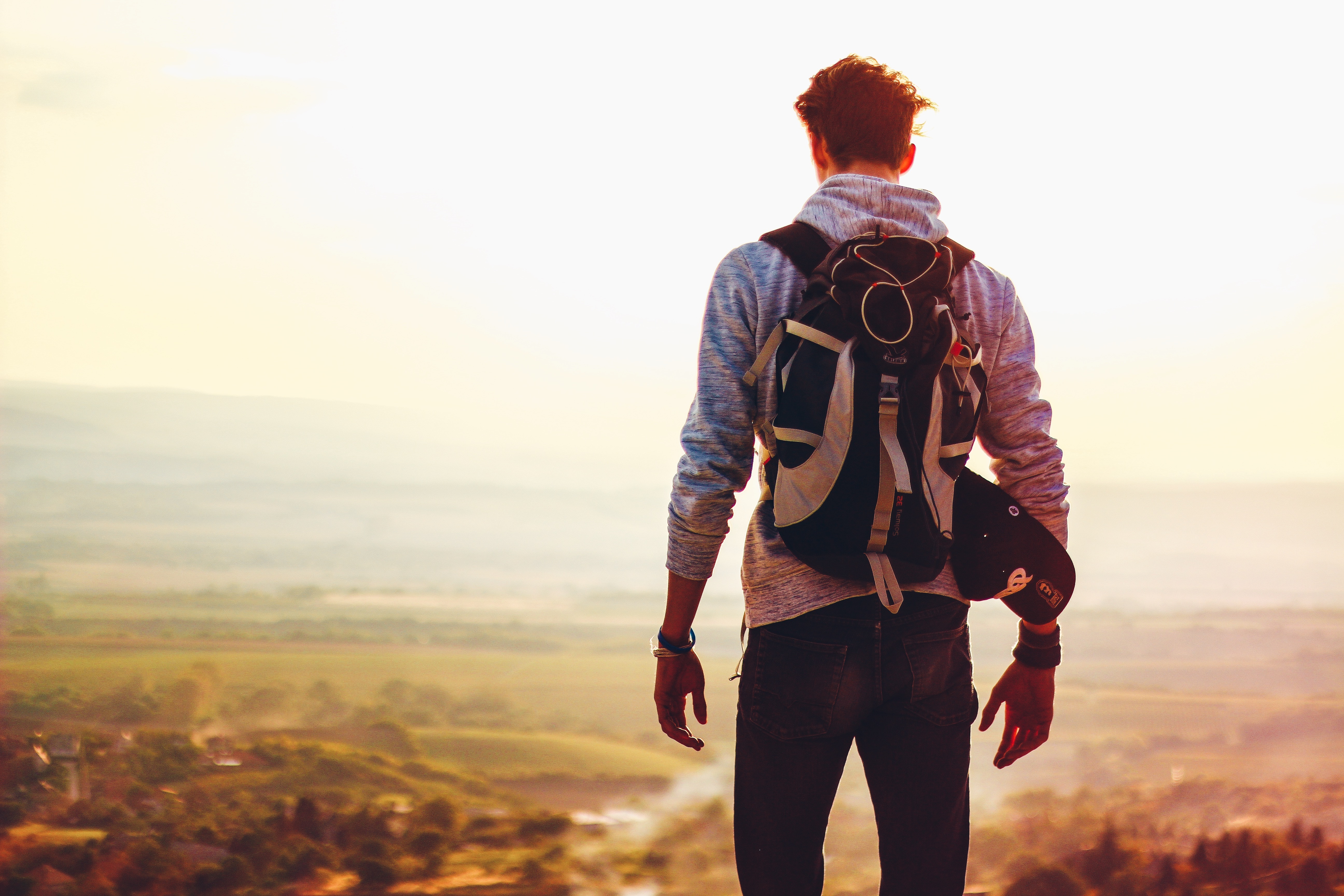 Arizona Criminal Record Expunged - back of man standing atop a rise, looking out across the valley