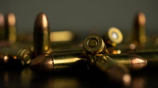 ammo on a table - firearm trafficking