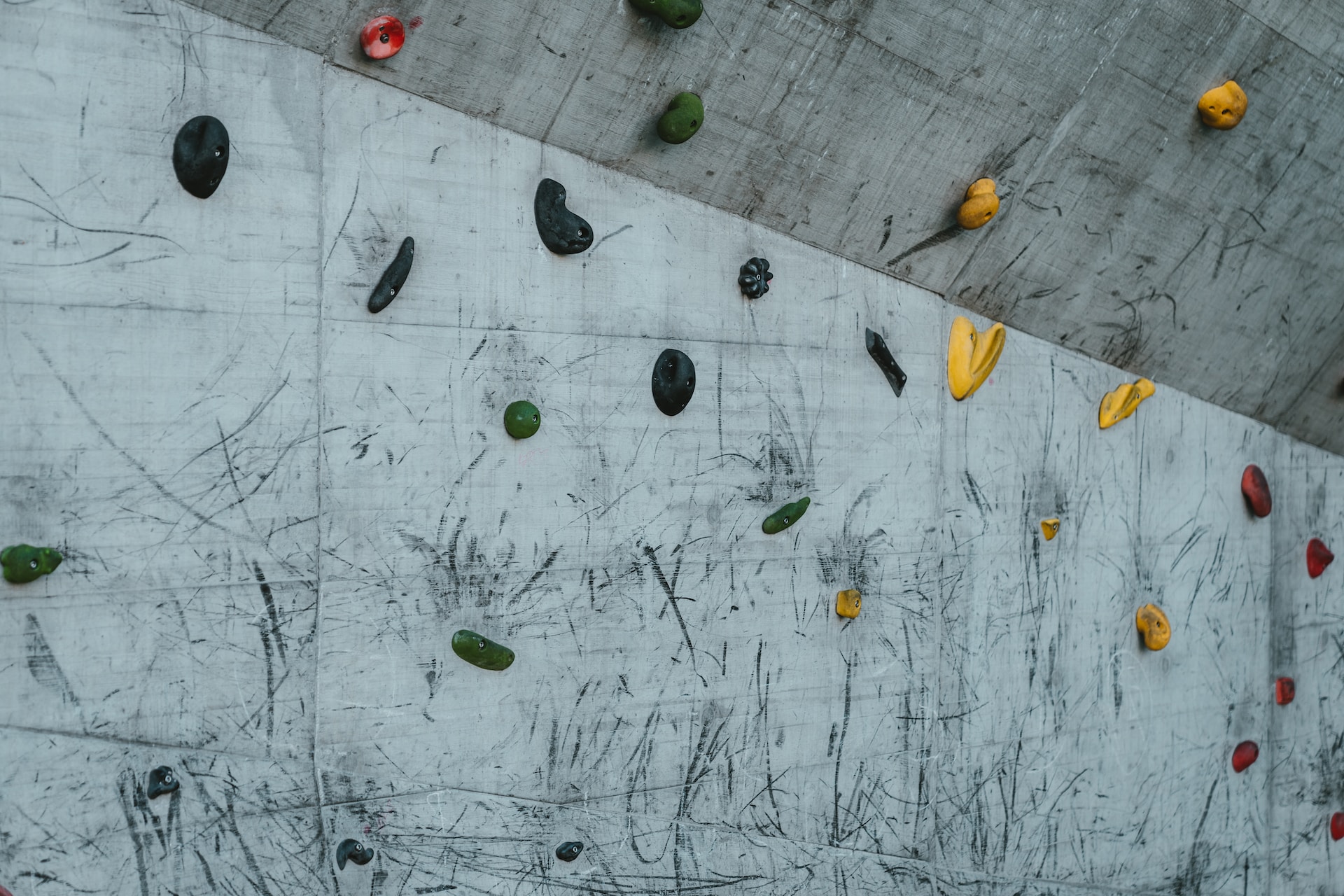 climbing holds on a wall - climbing a building is a crime