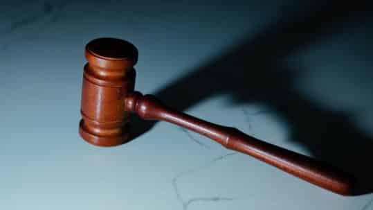gavel on blue background - criminal process in arizona