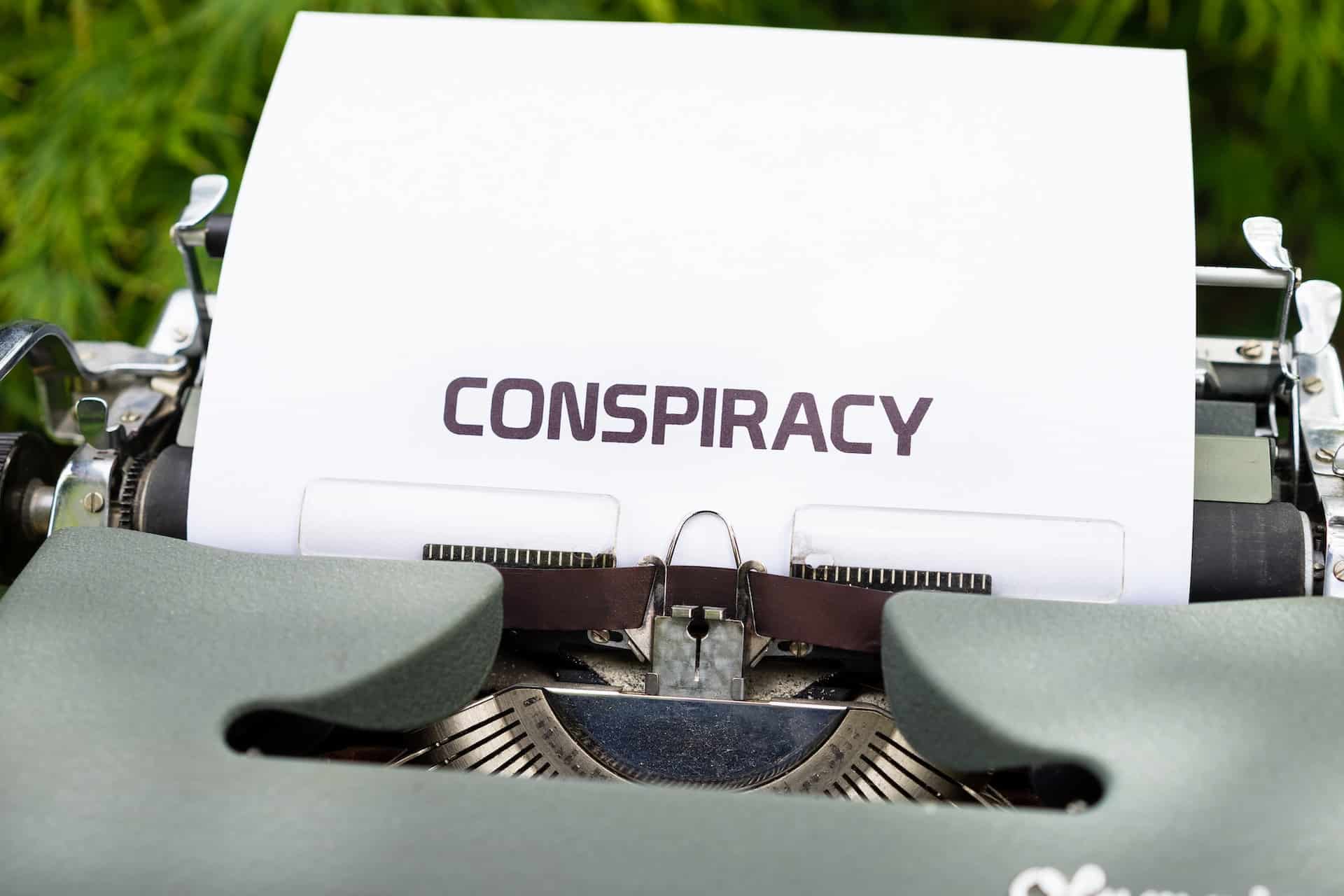 typewriter with paper that says conspiracy - murder conspiracy charges in Arizona