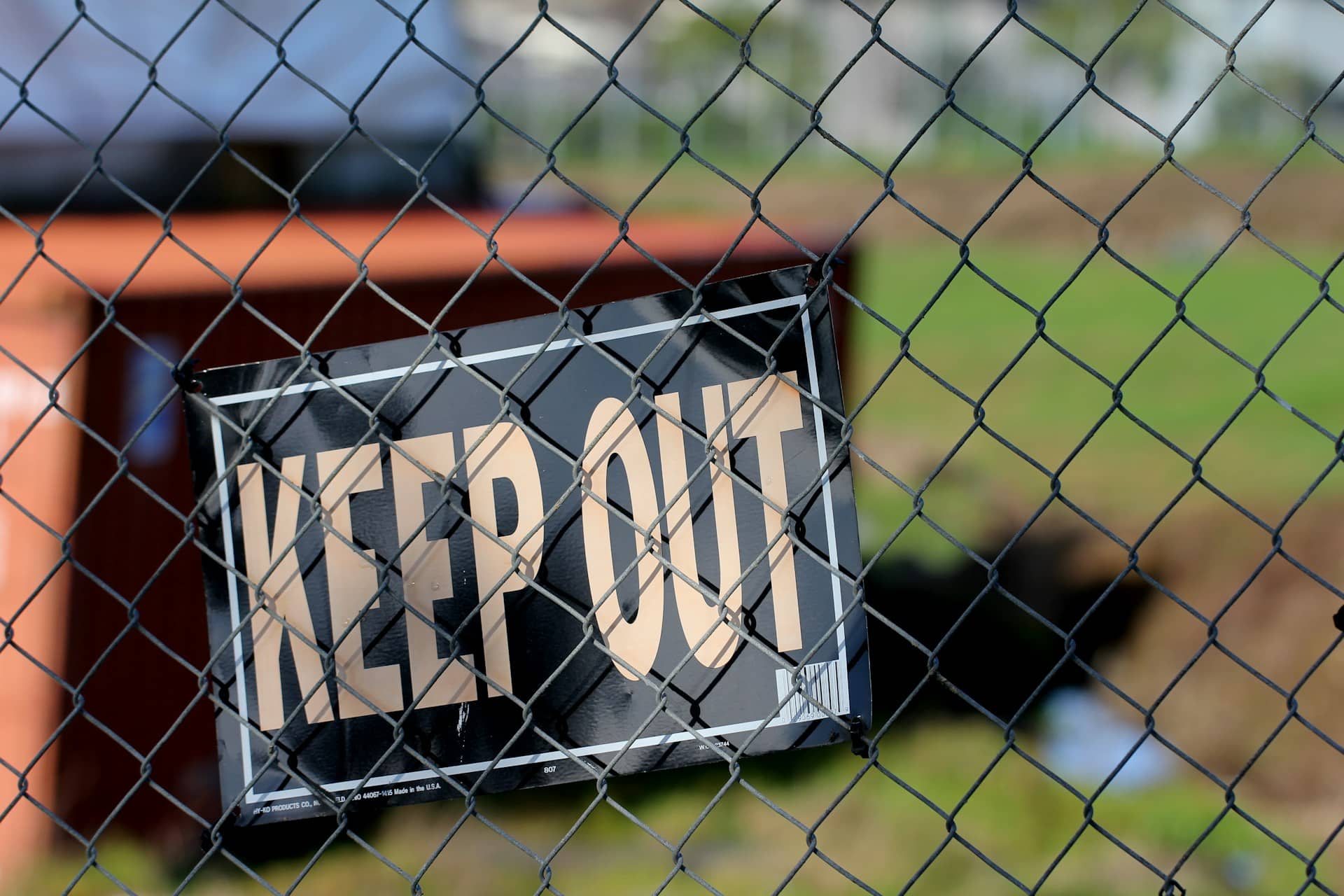 keep out sign on a fence