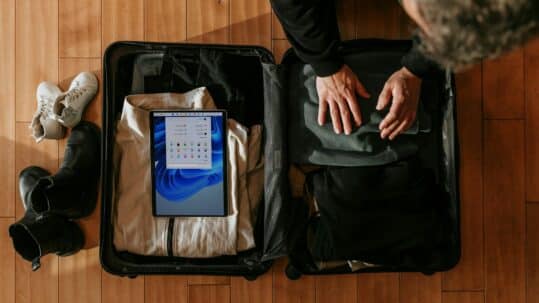 person packing a suitcase